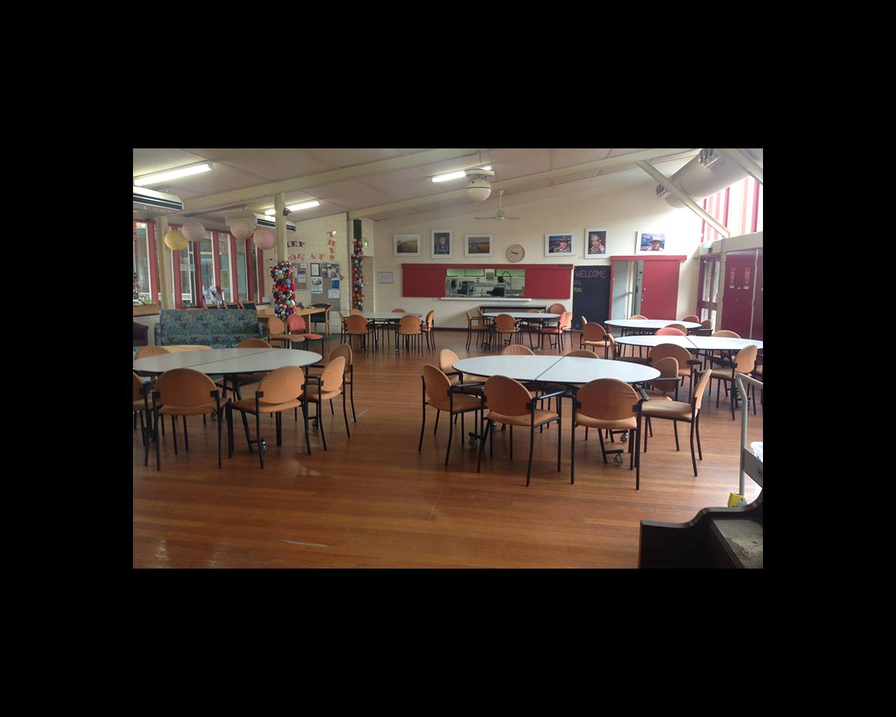 photo inside the Collingwood Senior Citizens Centre showing round tables and chairs