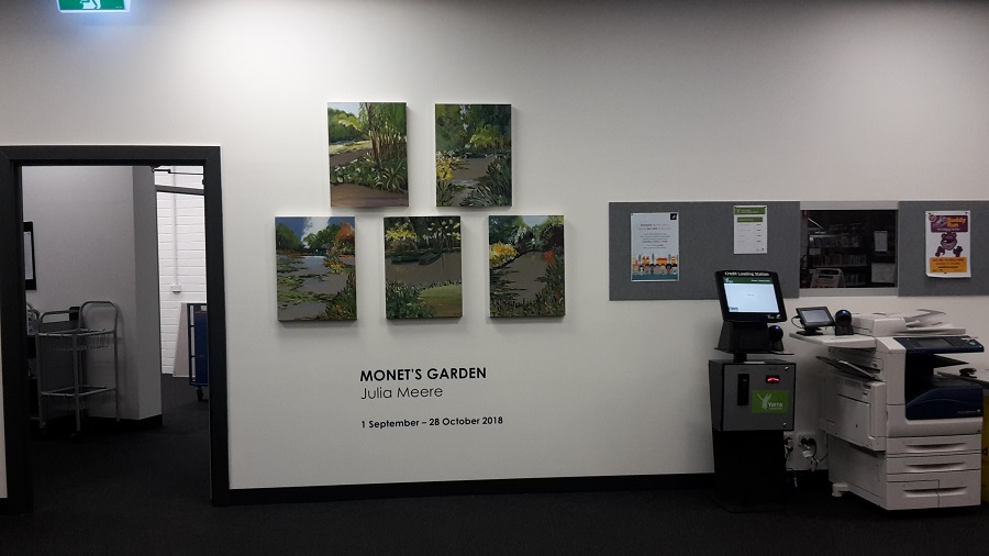 Exhibition installation of five paintings of a garden landscape inspired by Monet's Garden