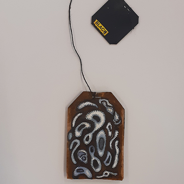 Ros Sultan Untitled Teabag #2, 2019 ink on an unused empty teabag, string and card 7 x 4.3cm (bag); 12.5cm (string); 2.3 x 3cm (tag); 30 x 21.5cm framed