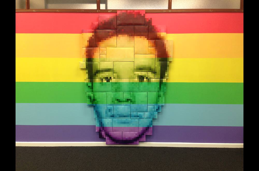 Artwork by Mark McCarthy showing boys face in rainbow colours