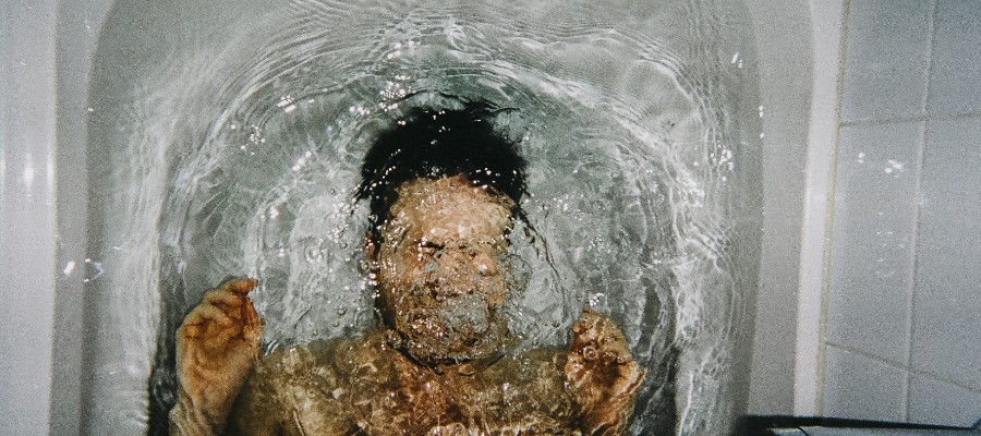 Man in bathtub underwater