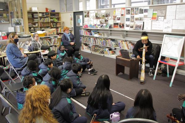 Yalinguth team including artist/musician Jason Tamiru talk to students at Sacred Heart Primary School