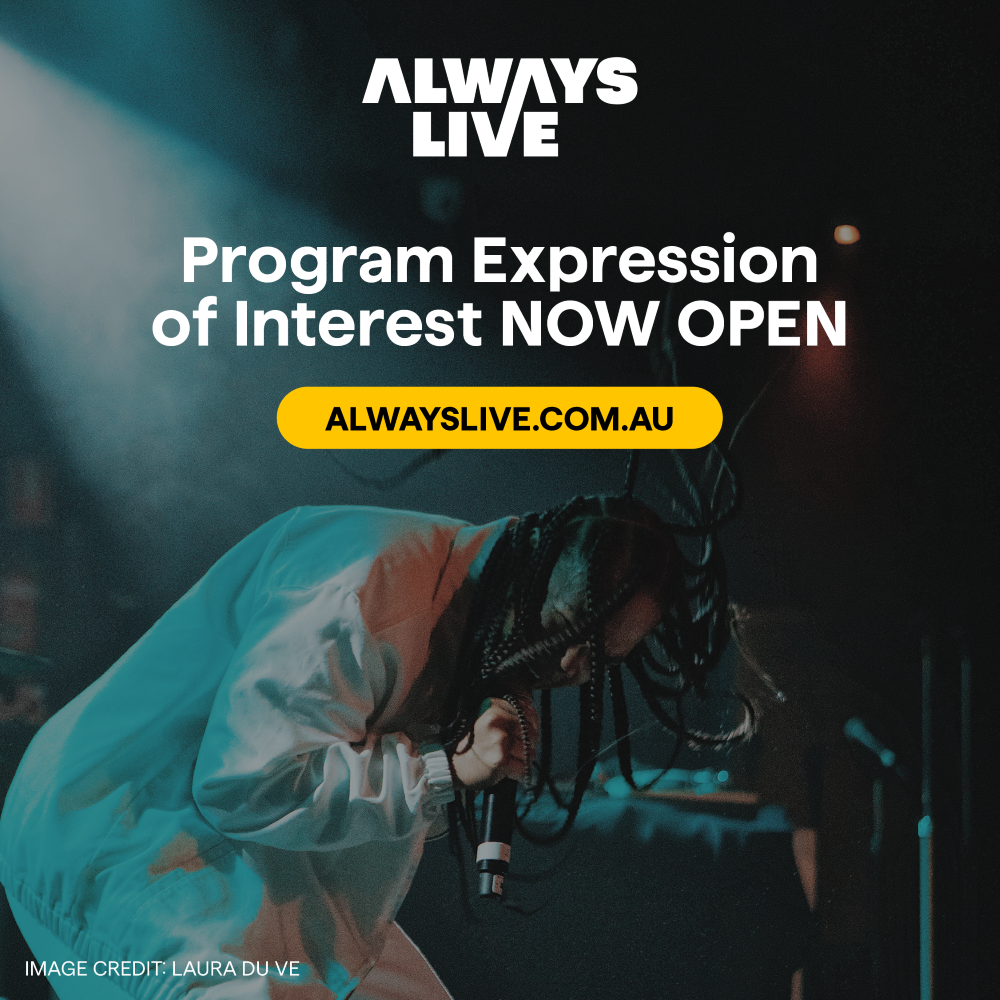 Landscape image of artist in white outfit with braided hair leaning forward and singing into microphone against a dark background with green light on the performer. ALWAYS LIVE logo in white at top of image. Text over the image reads “Program Expression of Interest NOW OPEN.” Yellow button over image contains text “alwayslive.com.au”. 